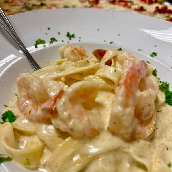 Shrimp Alfredo with fettuccine and a white pizza