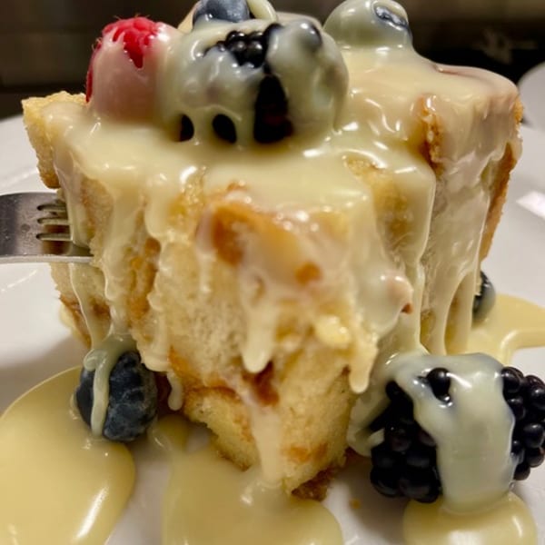 Berry bread pudding with vanilla cream